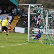 Adam Boyes' header loops over Harrogate Town keeper James Belshaw to give Avenue the lead Picture: John Rhodes