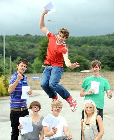 Star pupils at Beckfoot School, Bingley, with Rory Brigstock-Barron jumping for joy at his results.