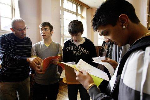 Students at Greenhead School, Keighley, examine their results.