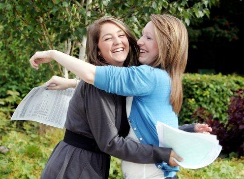Upper Wharfedale School pupils Beth Lee and Emily Spurden embrace each other. Both girls will be going Craven College.