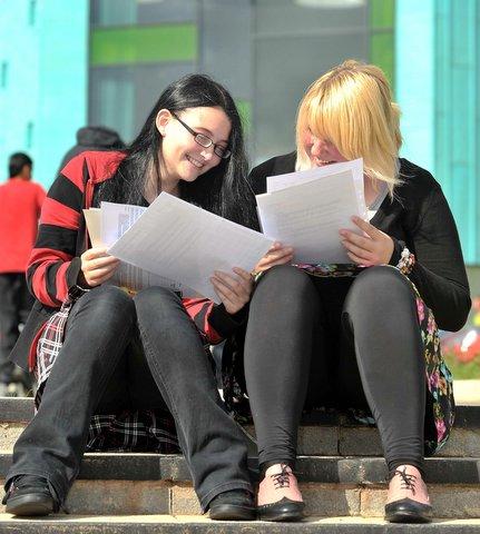 Buttershaw Business and Enterprise College students Georgina Riley, right, and Nichole Topham look at their results.