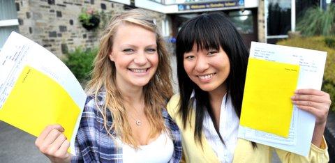 Guiseley School students Catherine Born (9A*, 2A) and Yuqing Jiang (8A*, 3A) get their results.