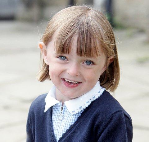 Dressed in her school uniform, Megan Hope Butler looks like any other four-year-old starting school. 