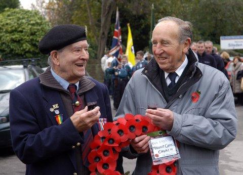 Reg Bolton, Royal Engineers, and Bernard Rush enjoy a warming tot before the start of the Silsden parade.