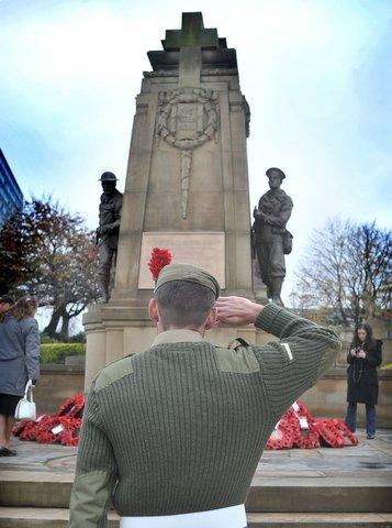 Lance Corporal McKenzie of the Black Watch, who has just returned from Afghanistan, salutes the Cenotaph during the Remembrance Day Parade in Bradford city centre.