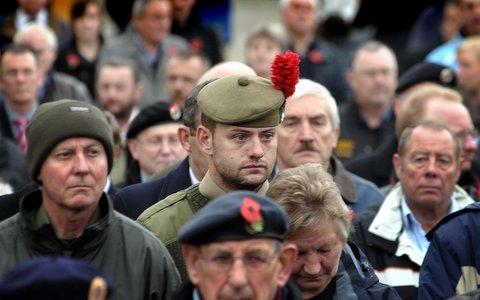 Lance Corporal McKenzie of the Black Watch, who has just returned from Afghanistan, joins in the Remembrance Day Parade in Bradford city centre.