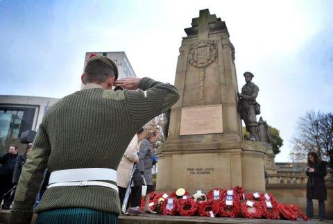 Lance Corporal McKenzie of the Black Watch, who has just returned from Afghanistan, salutes the Cenotaph during the Remembrance Day Parade in Bradford city centre.