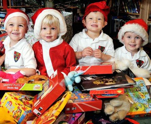 Children at a Burley-in-Wharfedale school thought of under-privileged youngsters when they put gifts under the Christmas tree. 
Pupils at Ghyll Royd School in Burley collected toys for the Children's Charity Circle. 
