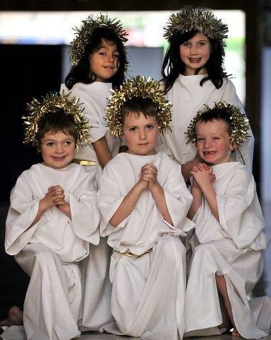 Playing angels in St Joseph's Catholic Primary School Nativity were, from the left, back Imongn Maguire and Isabelle O'Connor. Front, Alfie Bottomley, Denna Nash and Dominic Nunn.
