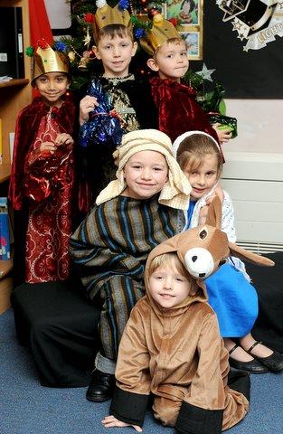 Mary, Joseph, the Three Kings and the Donkey in St Paul's C of E Primary School Nativity.