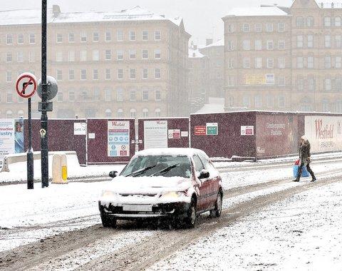 Snow hits Bradford city centre on Christmas Eve.