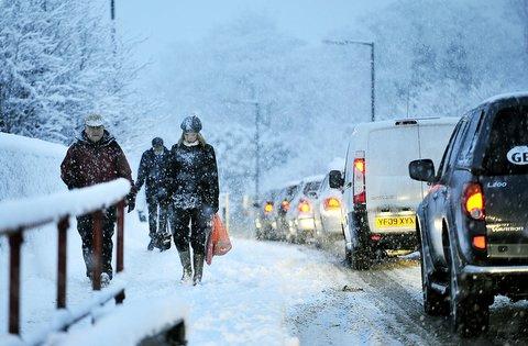 Commuters and drivers battling their way to work.