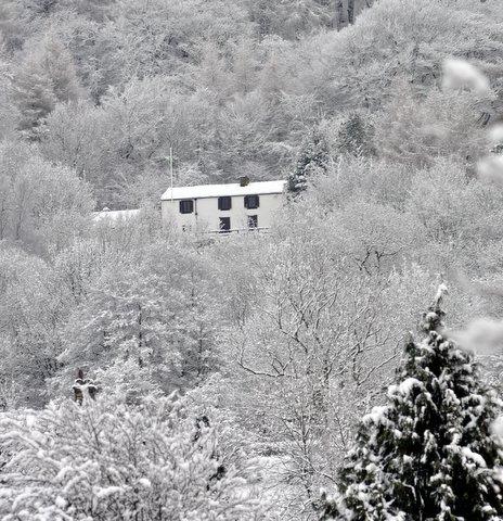 The aptly named 'White House' almost disappears into the snowy backdrop of Otley Chevin.