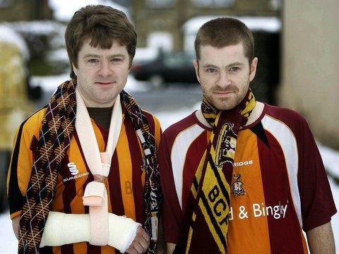A Bradford City fan says he will not let a broken wrist stop him from walking to every home game with his twin brother for the rest of the season to raise funds for the Bradford Burns Unit. 