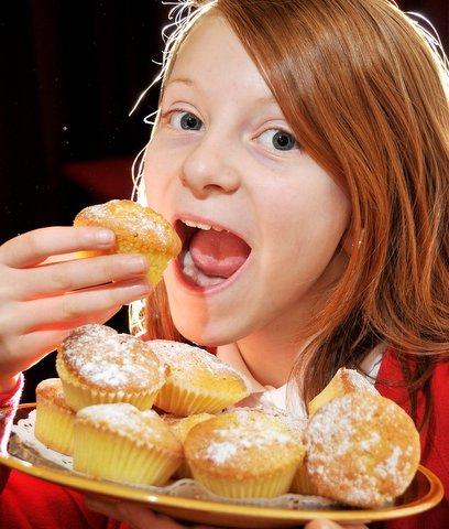 Youngsters at a Westfield Junior School, Yeadon, raised more than £300 for Haiti with a ‘dress as you like day’ and a bun sale. 
Pupil Chloe Glass, 11, is pictured trying one of the buns.
