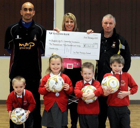 Four fundraisers have been congratulated on their efforts by Bradford City footballer Zesh Rehman. 
The defender was at Low Ash Primary School, Shipley, to award signed footballs, to Dominic Baldwin, Owen Briscoe, Fabio Castenheira and Alicia Rosconie
