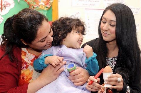 Children dressed eggs as Humpty Dumpty at a Big Breakfast Week celebration at Allerton Children’s Centre. 
Parents, carers and work experience volunteer Samina Akhtar, pictured with 19-month-old Zaina Obaid and her mum Kousar, lent a hand. 

