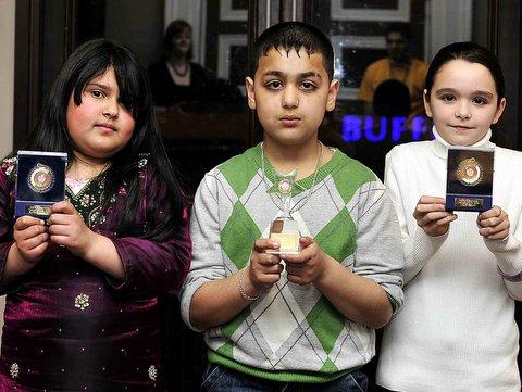 Under-11 Economic Wellbeing Award winner Sajjad Mohammed with fellow nominees Rukhsar Jhangir, left, and Jodie Brown.