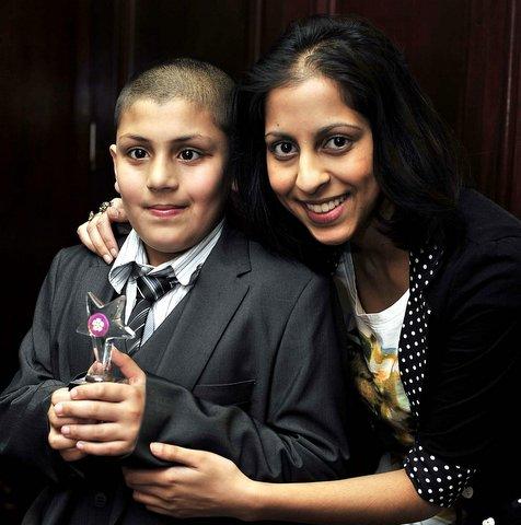 Under-11 Stay Safe Award winner Muhammed Ali Hassan with TV star Nikki Patel from Coronation Street.