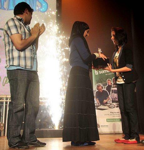Stay Safe Award 12-25 winner Sabah Afzal receives here award from TV star Nikki Patel from Coronation Street.