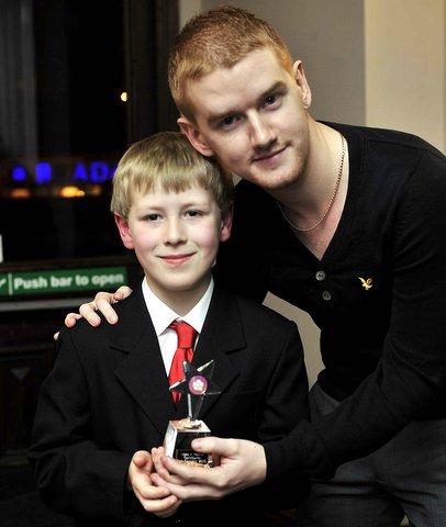 Under 11 Positive Contribution Award winner James Sell with TV star Mikey North from Coronation Street.