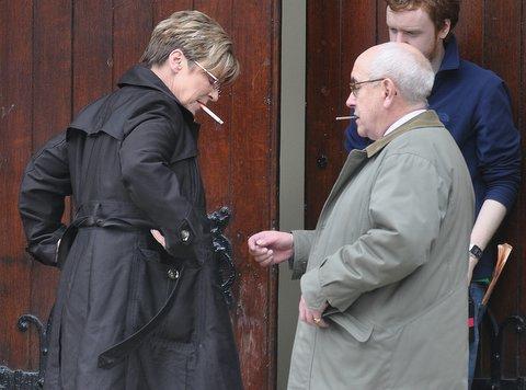 Coronation Street stars Anne Kirkbride(Deirdre Barlow)and Malcolm Hebden(Norris Cole) take a break from filming scene at Bradford's City Hall.