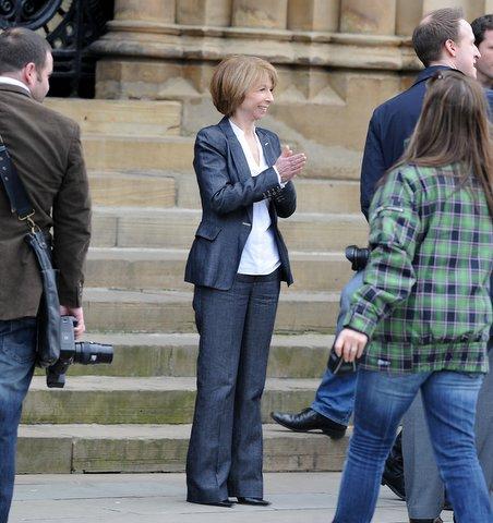 Gail McIntyre (Helen Worth) takes a break from filming outside City Hall.