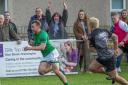 Wharfedale's Rian Hamilton wins a foot race to the try line. Picture: Ro Burridge