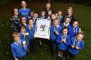 Pupils at Burley Oaks Primary school are awarded with a UCI World Championship rainbow T-shirt