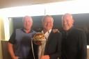 From left, Mark Gilliver, Neil Hartley and Craig White with the ICC World Cup trophy at Bradford & Bingley