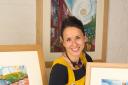 Artist Kate Lycett with a selection of her work