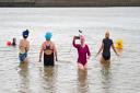 Members of the 'Salty Seabirds' wild swimming group. Pic: Simon Dack/Alamy Live News