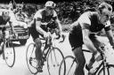 Brian Robinson, right, races in the 1956 Tour de France. Picture: PA
