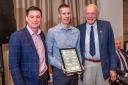 Rob Jebb (centre) receiving the CA Rhodes Memorial Trophy award at the back end of last month.