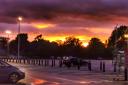 The sun setting over a Morrisons car park