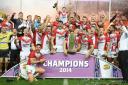 St Helens celebrate with the Super League trophy after their win against Wigan Warriors