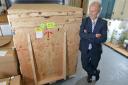 Professor Laurence Patterson with the new proteomics mass spectrometer machine as it arrived at the University of Bradford