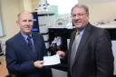 Professor Laurence Patterson, left, receives a Gannett Foundation cheque for £20,000 from T&A Editor Perry Austin-Clarke for Bradford Crocus Cancer Appeal