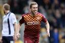 LAPPING IT UP: Steve Davies celebrates scoring against play-off rivals Millwall as City build momentum