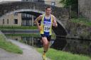 Saltaire Striders' Will Kerr helped Ben Smith towards his target of 401 marathons in 401 days Picture: Dave Woodhead