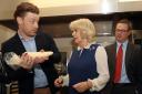 The Duchess of Cornwall is shown how to use a piping bag by Jamie Oliver (left) alongside Hugh Fearnley-Whittingstall (right) in the kitchen during a reception to launch The Great Get Together at Clarence House in London. Picture: Jonathan Brady/PA Wire