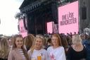 Ellie (centre) with Abbie Asquith-Brown (left) and Polly Asquith-Brown (right) at the One Love Concert in Manchester