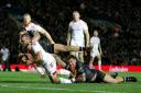 England's Josh Hodgson is held up just short of the try line during the International match at Elland Road