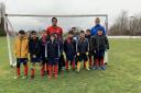 Manningham All Stars under-10s with departing coach Anil Nawaz and Eccleshill United manager Sean Regan (back right)