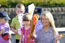 Bells are rung at Kiddi-Creche Nursery in Cottingley to celebrate the start of the Olympics
