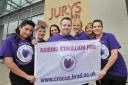 Jenny Watkinson and Victoria Collins from Bradford University join Jury’s Inn operations manager Mark Bussey and staff, ahead of the Crocus Week abseil