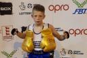 Patrick Coleman shows off his golden gloves