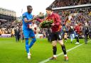 City captain Richie Smallwood and Leyton Orient's Omar Beckles with remembrance wreaths before last season's final home game
