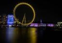 The London Eye lit yellow for Marie Curie’s National Day of Reflection. Pic: PA