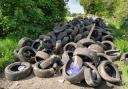 Tyres block the footpath down to the nature reserve